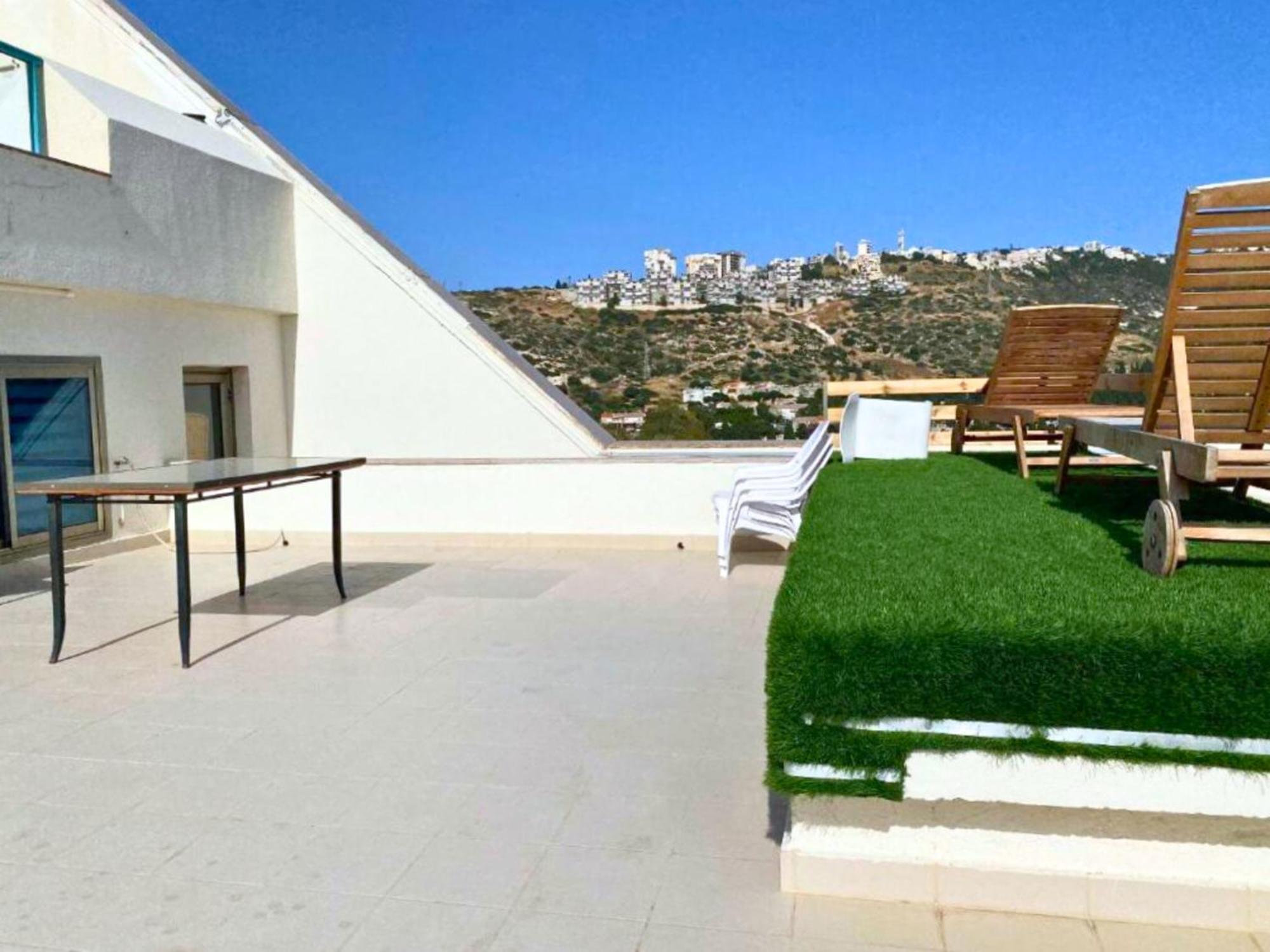 Almog מגדלי חוף הכרמל *